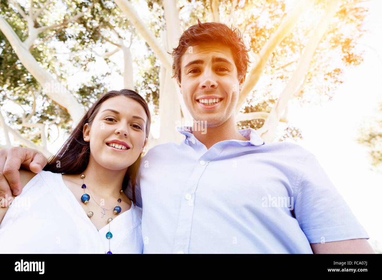 Young happy couple in the park in the summer Stock Photo - Alamy