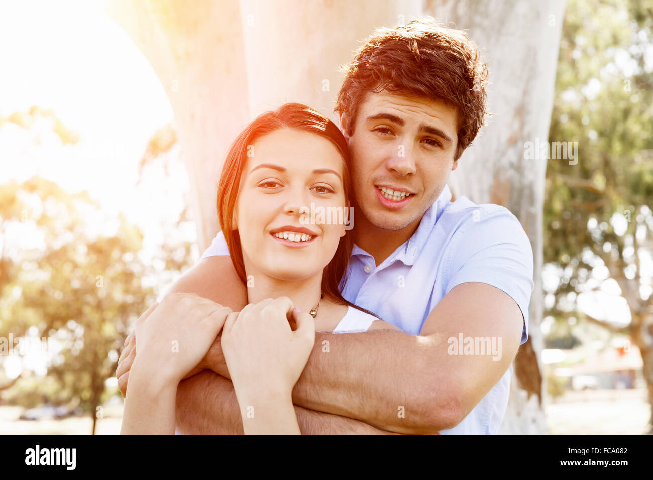 Young happy couple in the park in the summer Stock Photo - Alamy