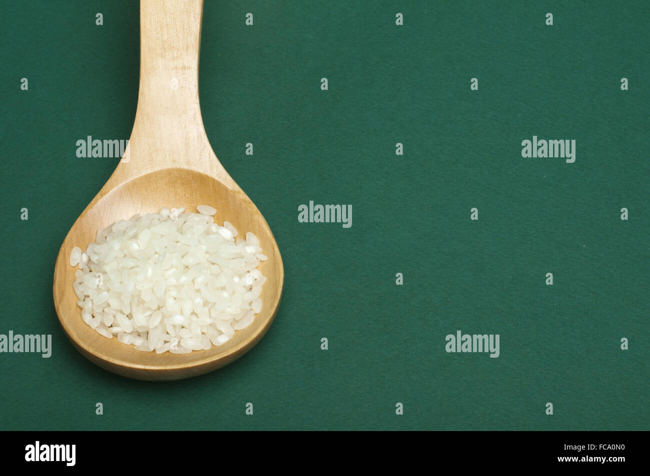 Baldeng Rice Rice baldo in wooden spoon Stock Photo - Alamy