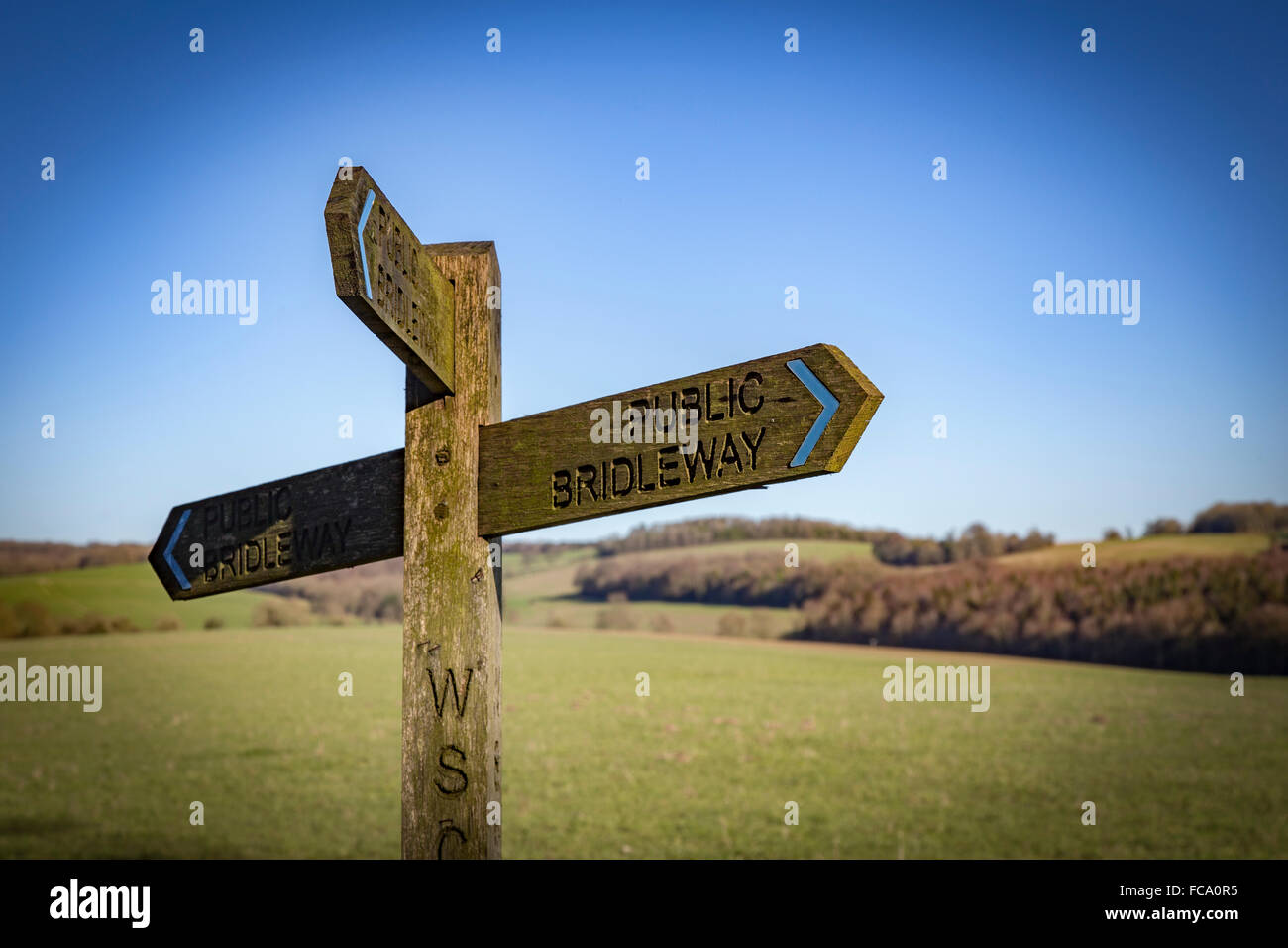 Bridleway country sign post with rolling hills in background. Stock Photo