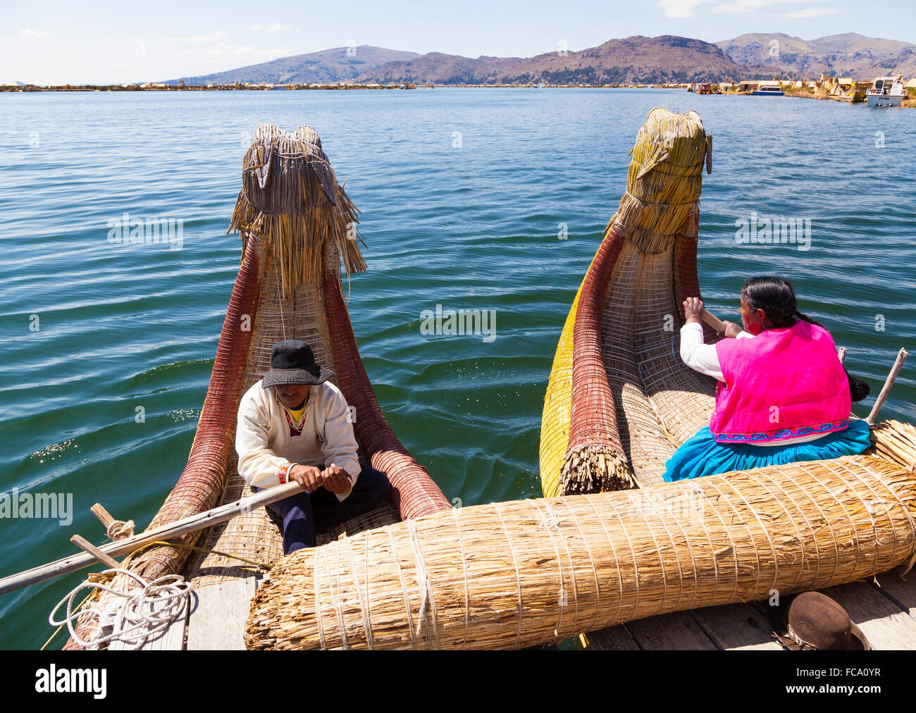 Rowing reed boat - Uros Islands Stock Photo