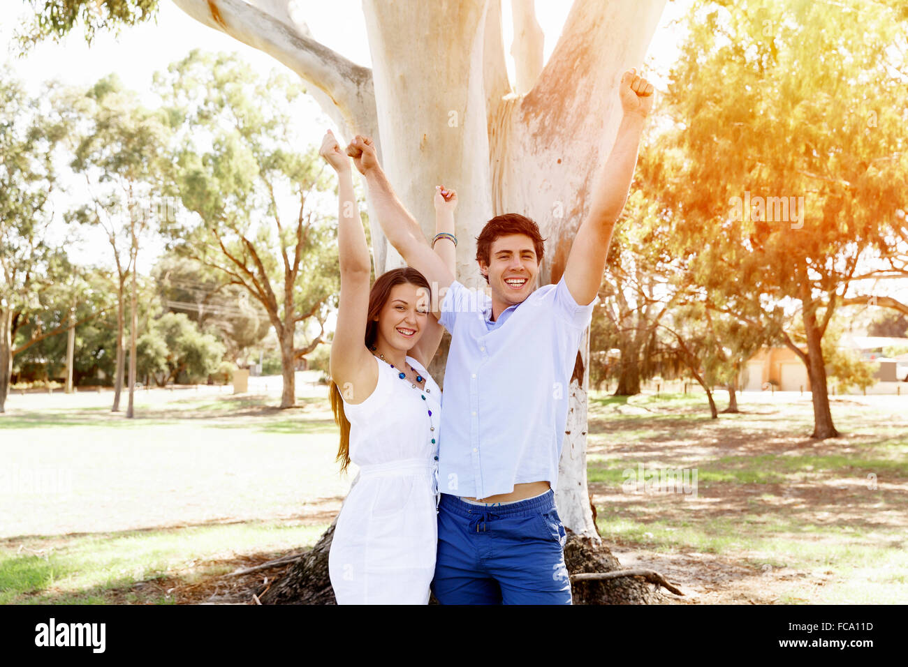 Young happy couple in the park in the summer Stock Photo - Alamy