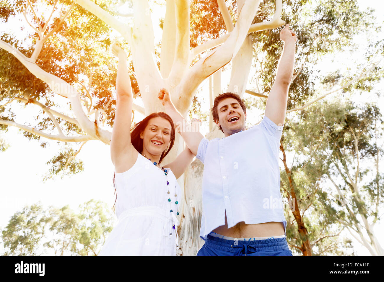 Young happy couple in the park in the summer Stock Photo - Alamy