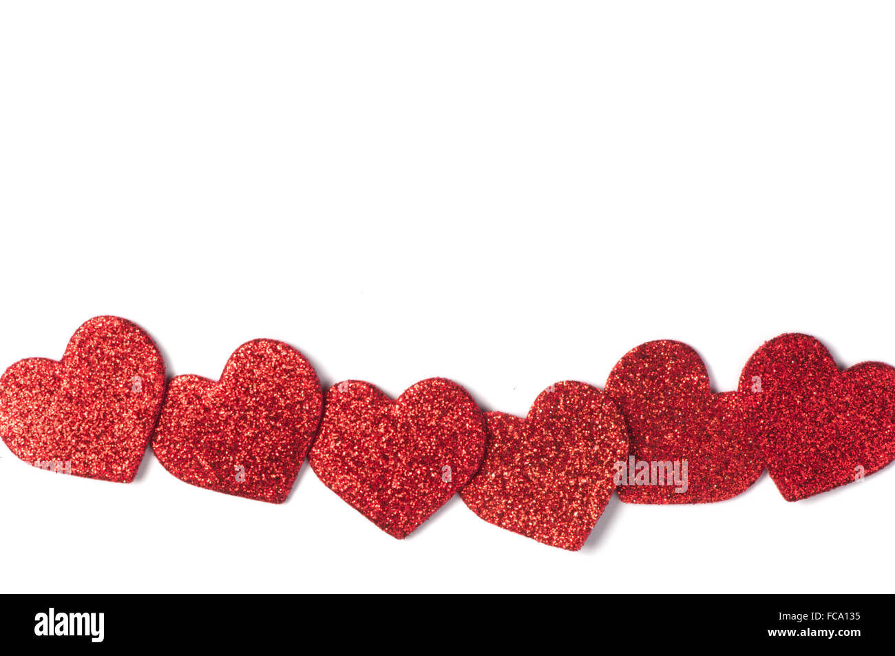 Red shiny hearts on white background Stock Photo - Alamy