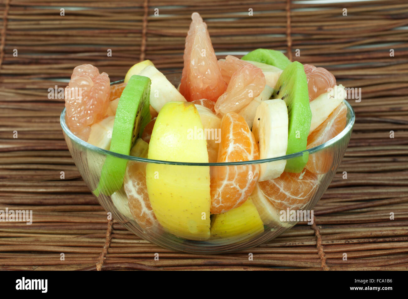 Fruit salad with citrus in a glass bowl Stock Photo - Alamy
