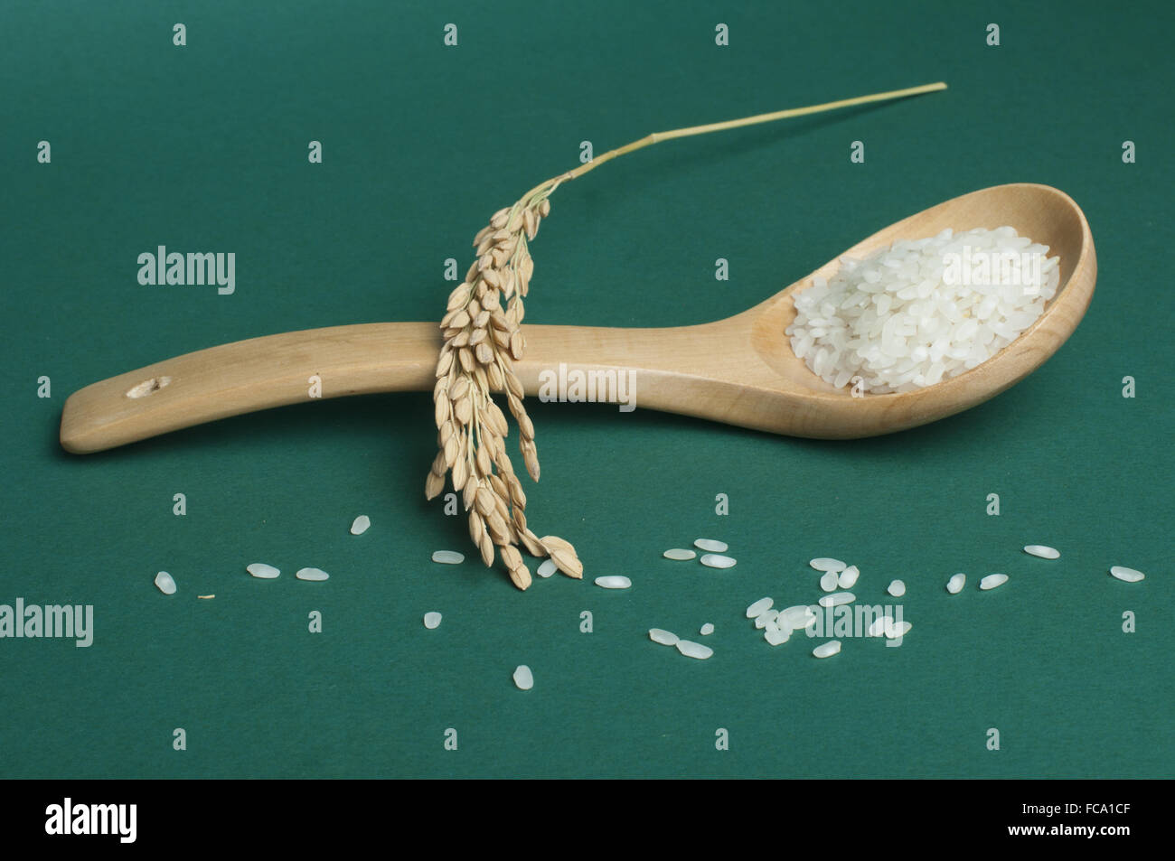 Baldeng Rice Rice baldo in wooden spoon Stock Photo - Alamy