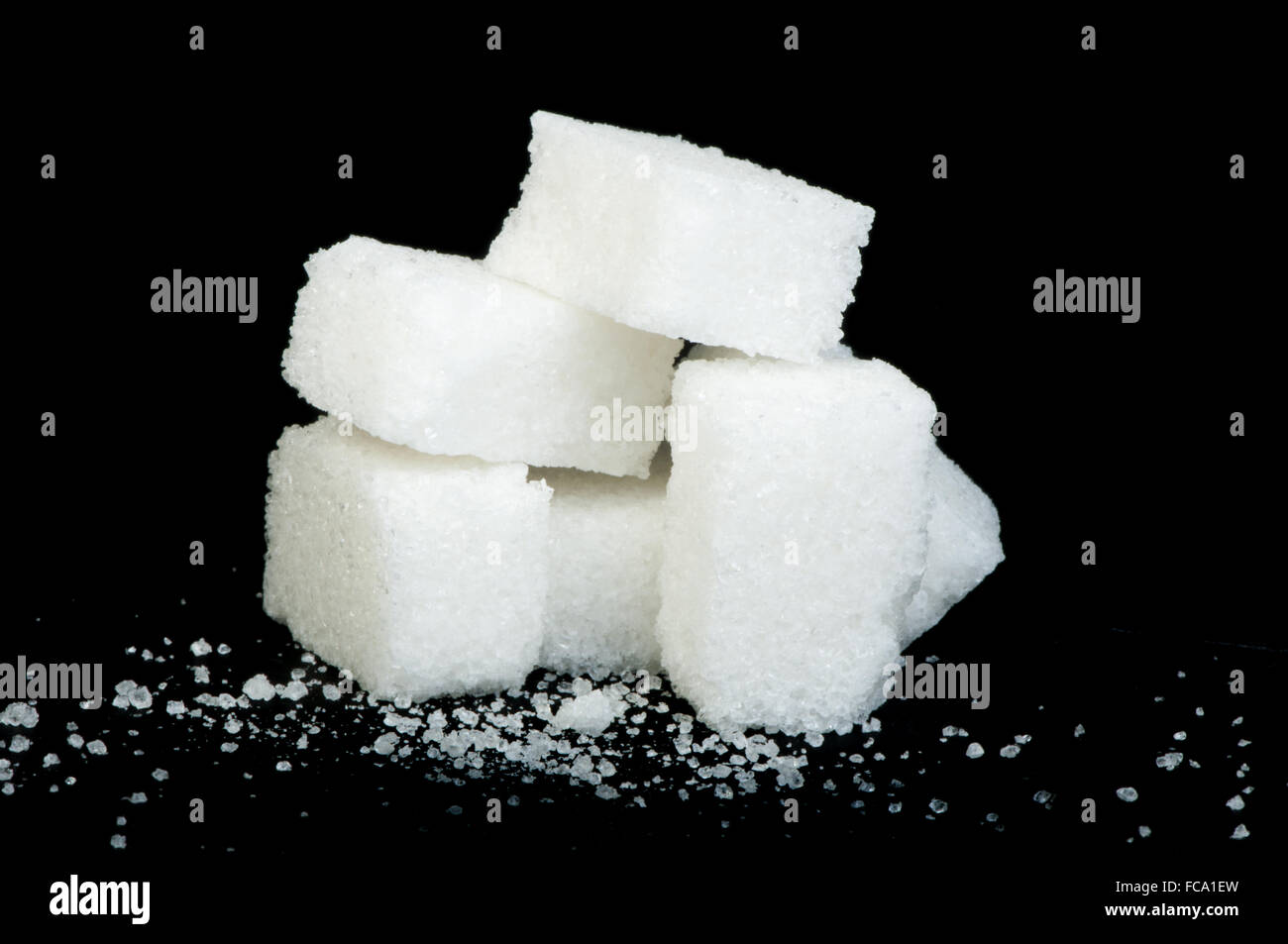 Sugar lumps black isolated Stock Photo - Alamy