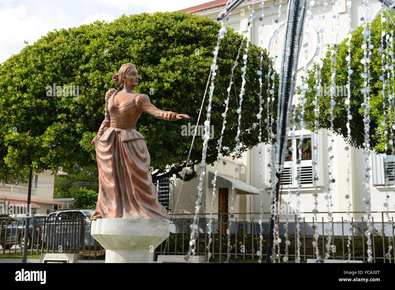 Bronze statue in a water fountain decorating the center square. Penuelas, Puerto Rico. Caribbean Island. US territory. Stock Photo