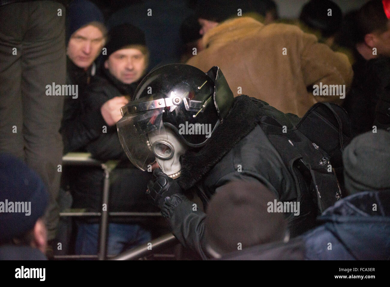 Some deputes were masked in policeman to be evacuated from parliament thrum aggressive mass Stock Photo