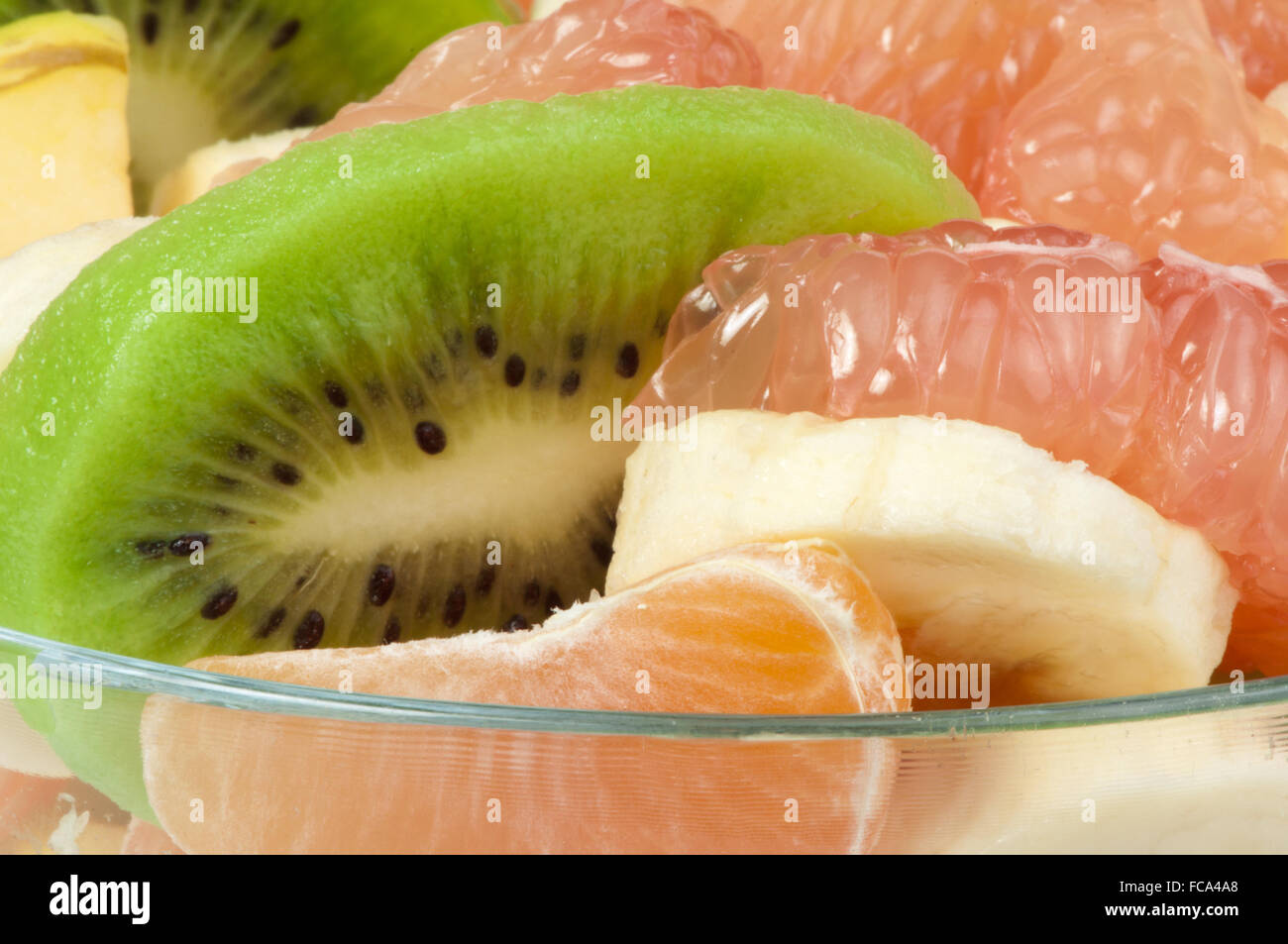 Fruit salad with citrus in a glass bowl Stock Photo - Alamy