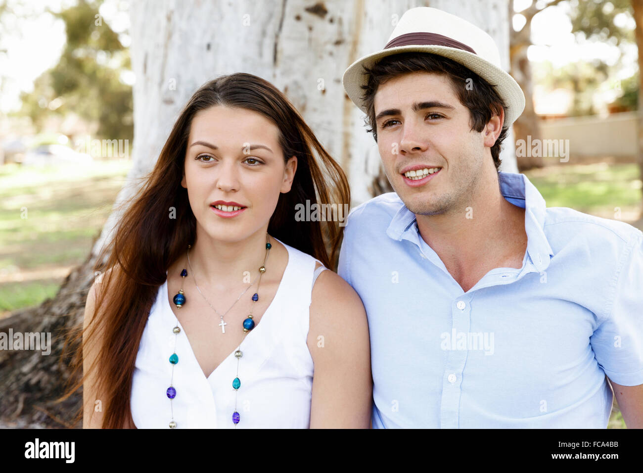 Young happy couple in the park in the summer Stock Photo - Alamy