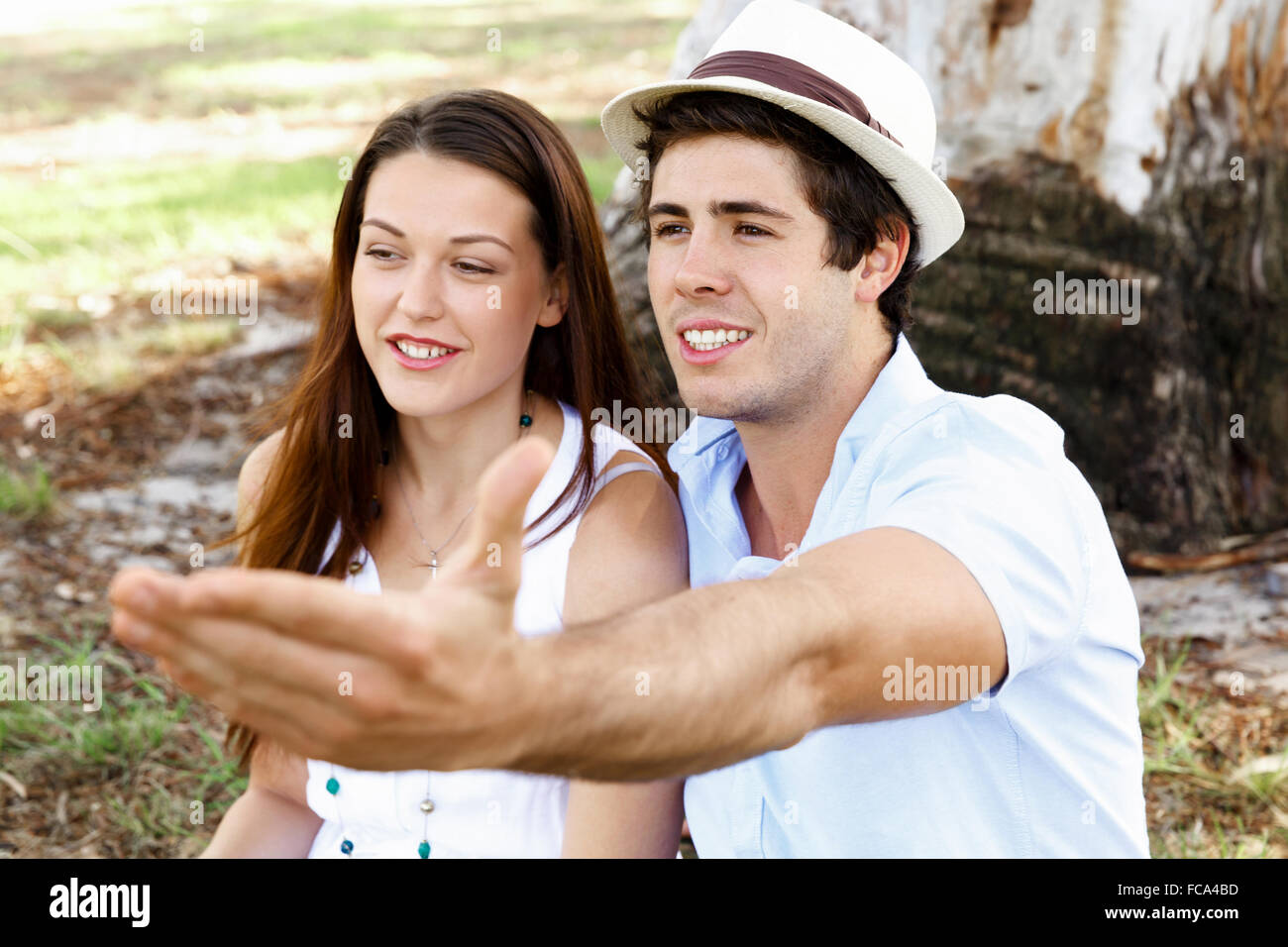 Young happy couple in the park in the summer Stock Photo - Alamy