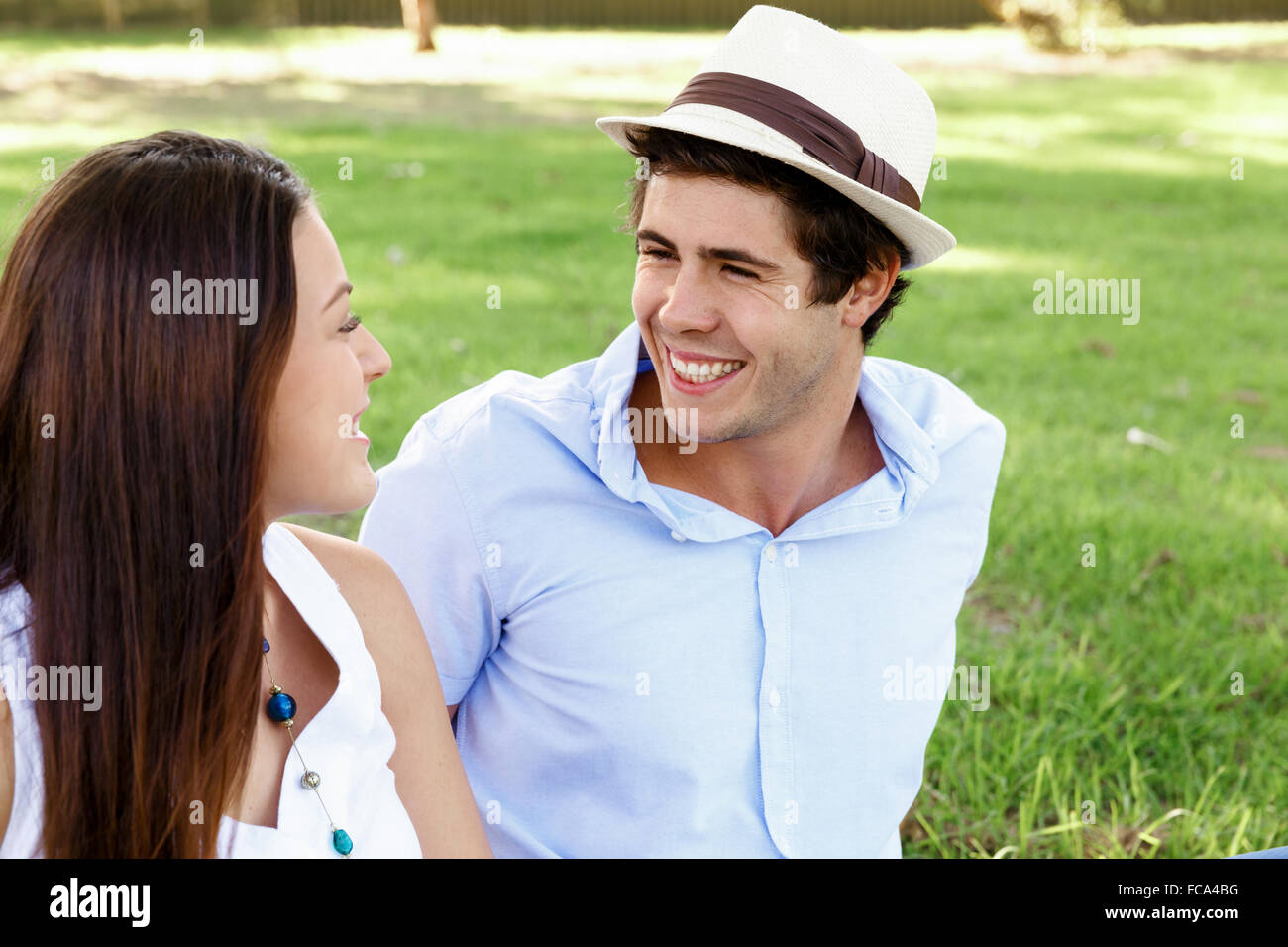Young happy couple in the park in the summer Stock Photo - Alamy