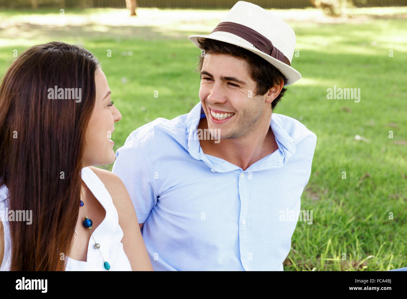 Young happy couple in the park in the summer Stock Photo - Alamy