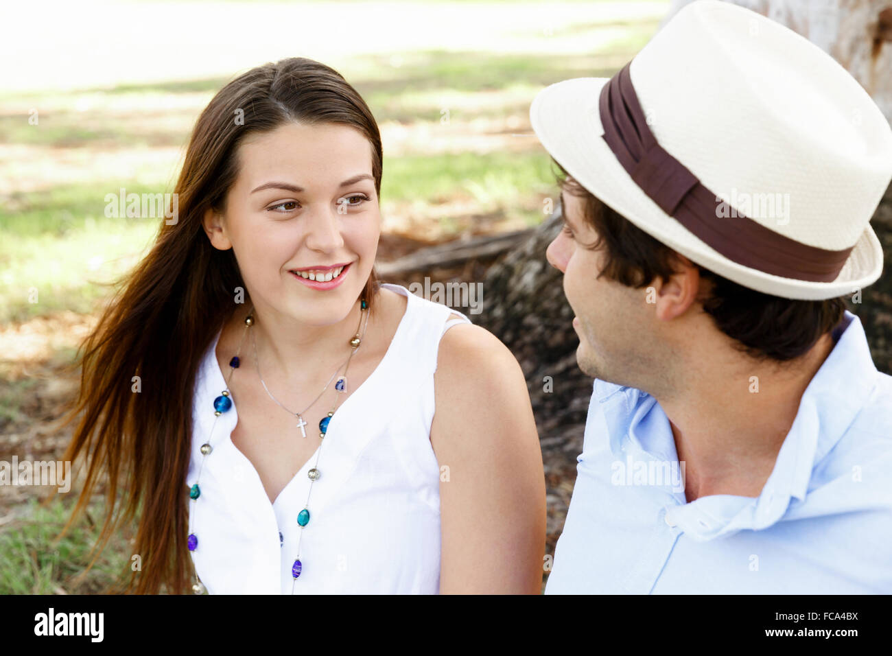 Young happy couple in the park in the summer Stock Photo - Alamy