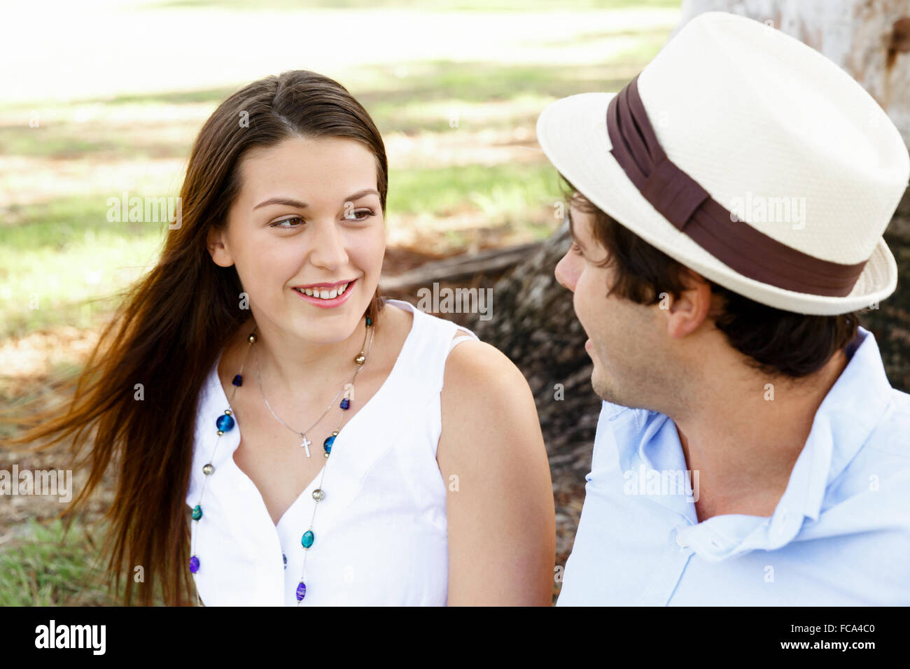 Young happy couple in the park in the summer Stock Photo - Alamy