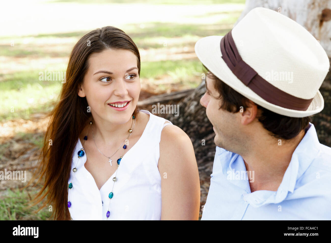 Young happy couple in the park in the summer Stock Photo - Alamy