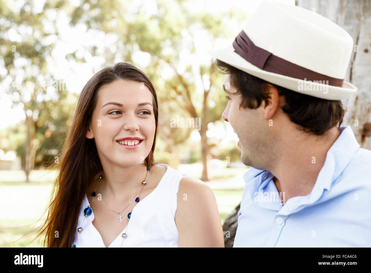 Young happy couple in the park in the summer Stock Photo - Alamy