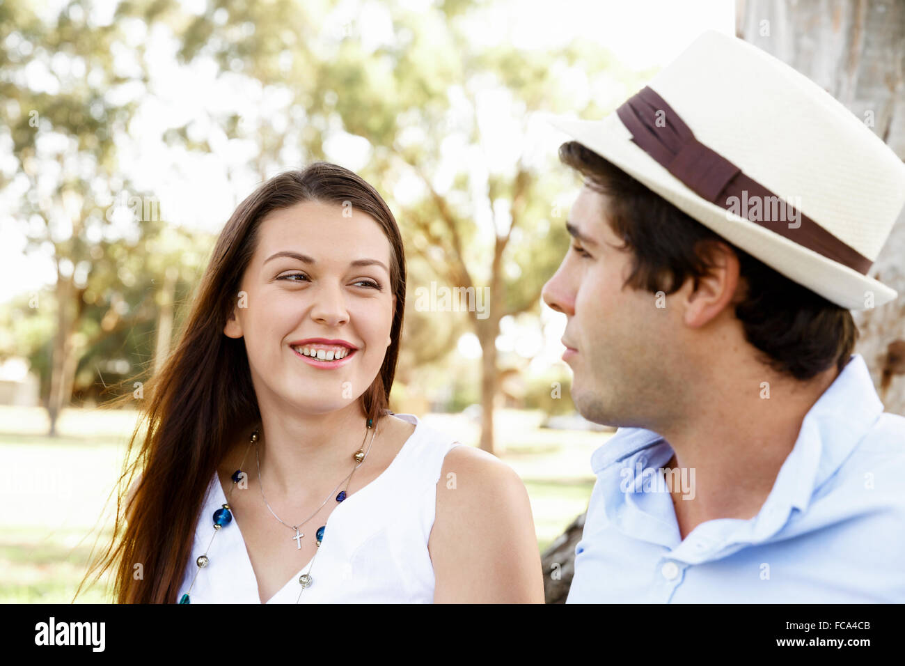 Young happy couple in the park in the summer Stock Photo - Alamy