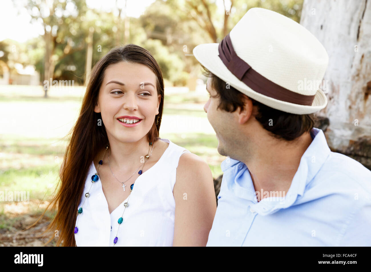 Young happy couple in the park in the summer Stock Photo - Alamy