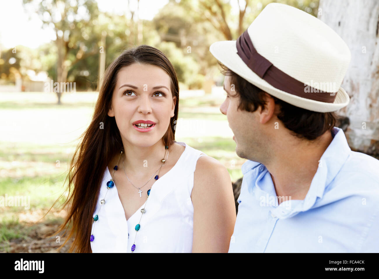 Young happy couple in the park in the summer Stock Photo - Alamy