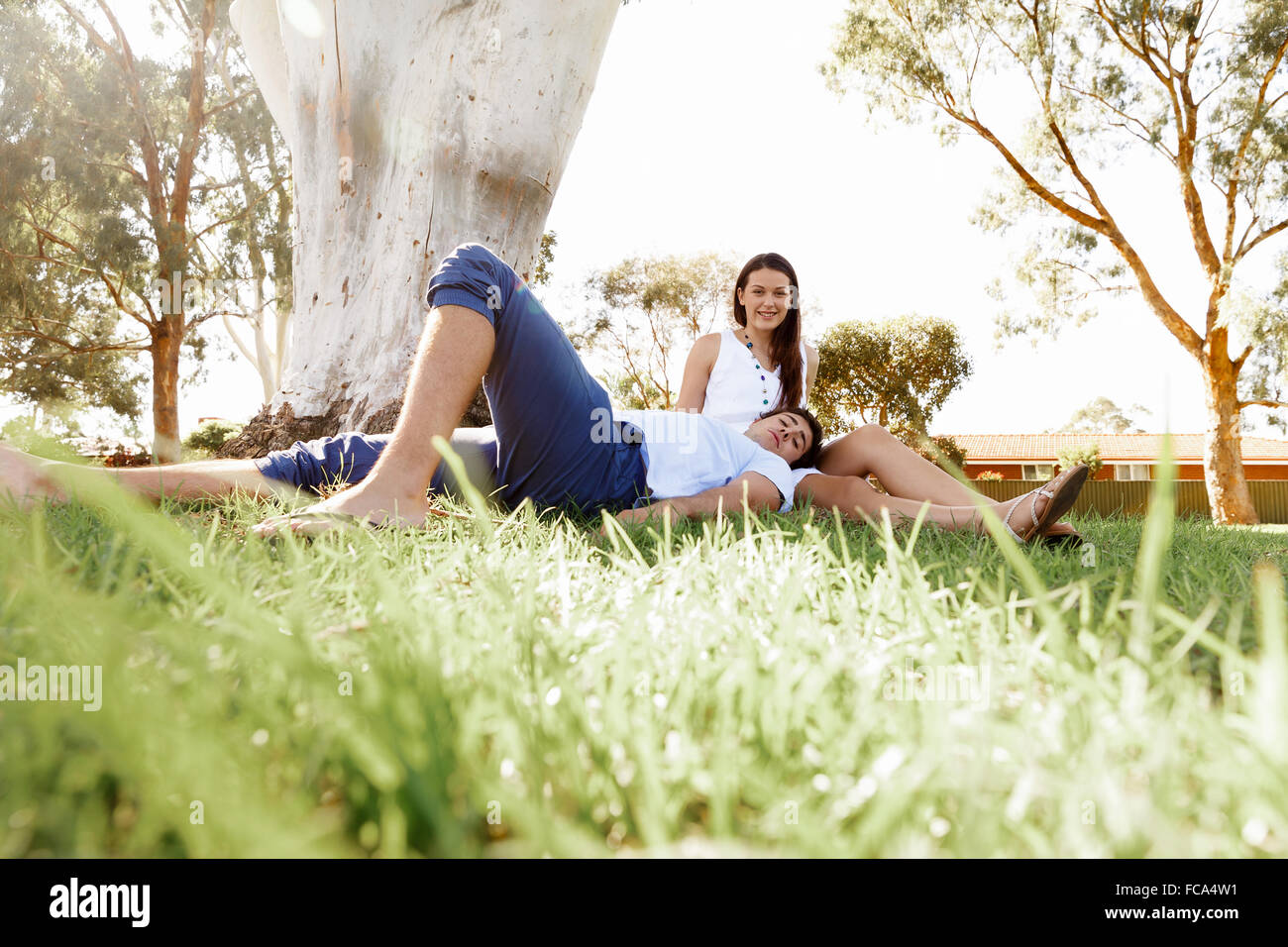 Young happy couple in the park in the summer Stock Photo - Alamy