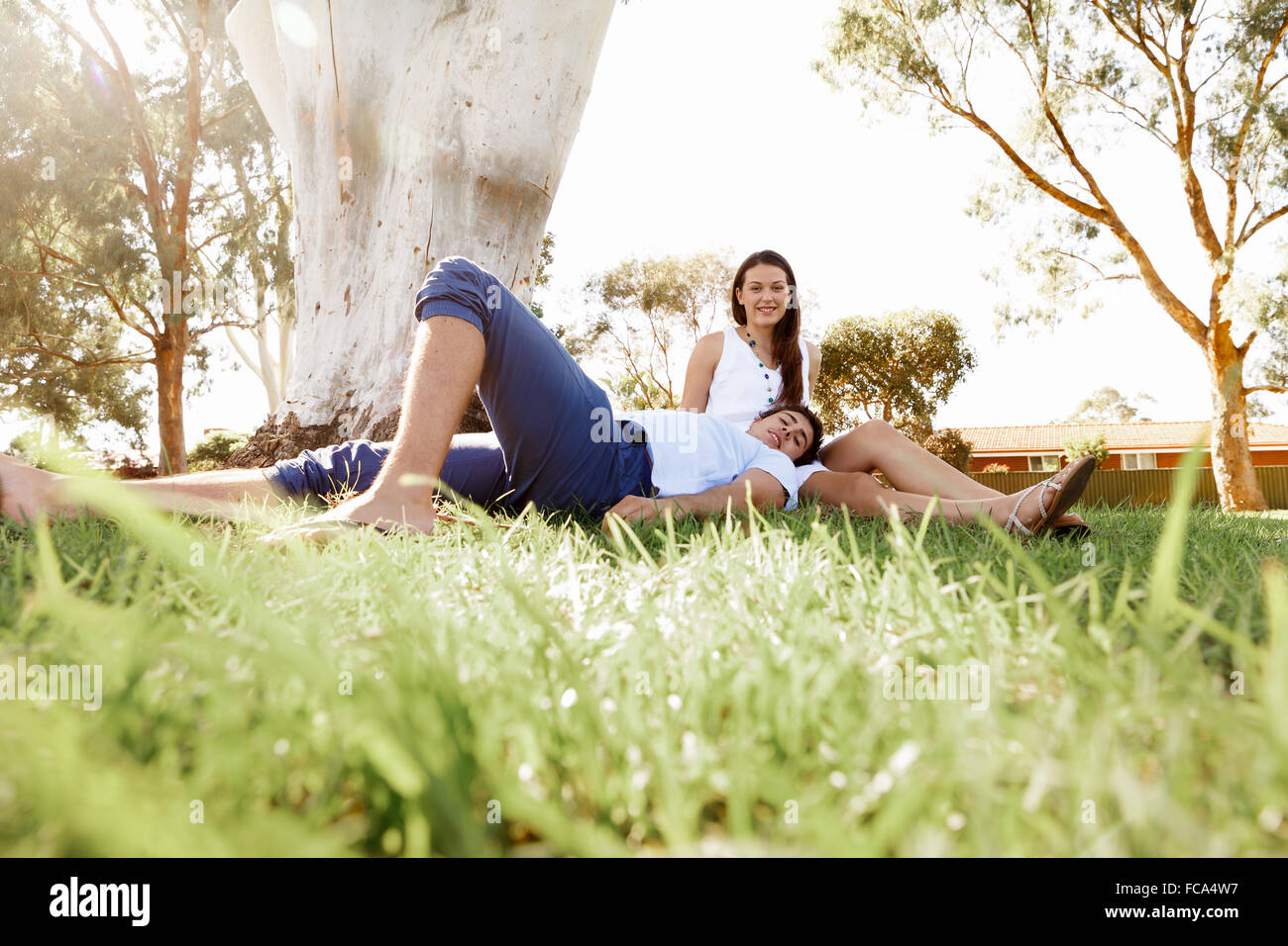 Young happy couple in the park in the summer Stock Photo - Alamy
