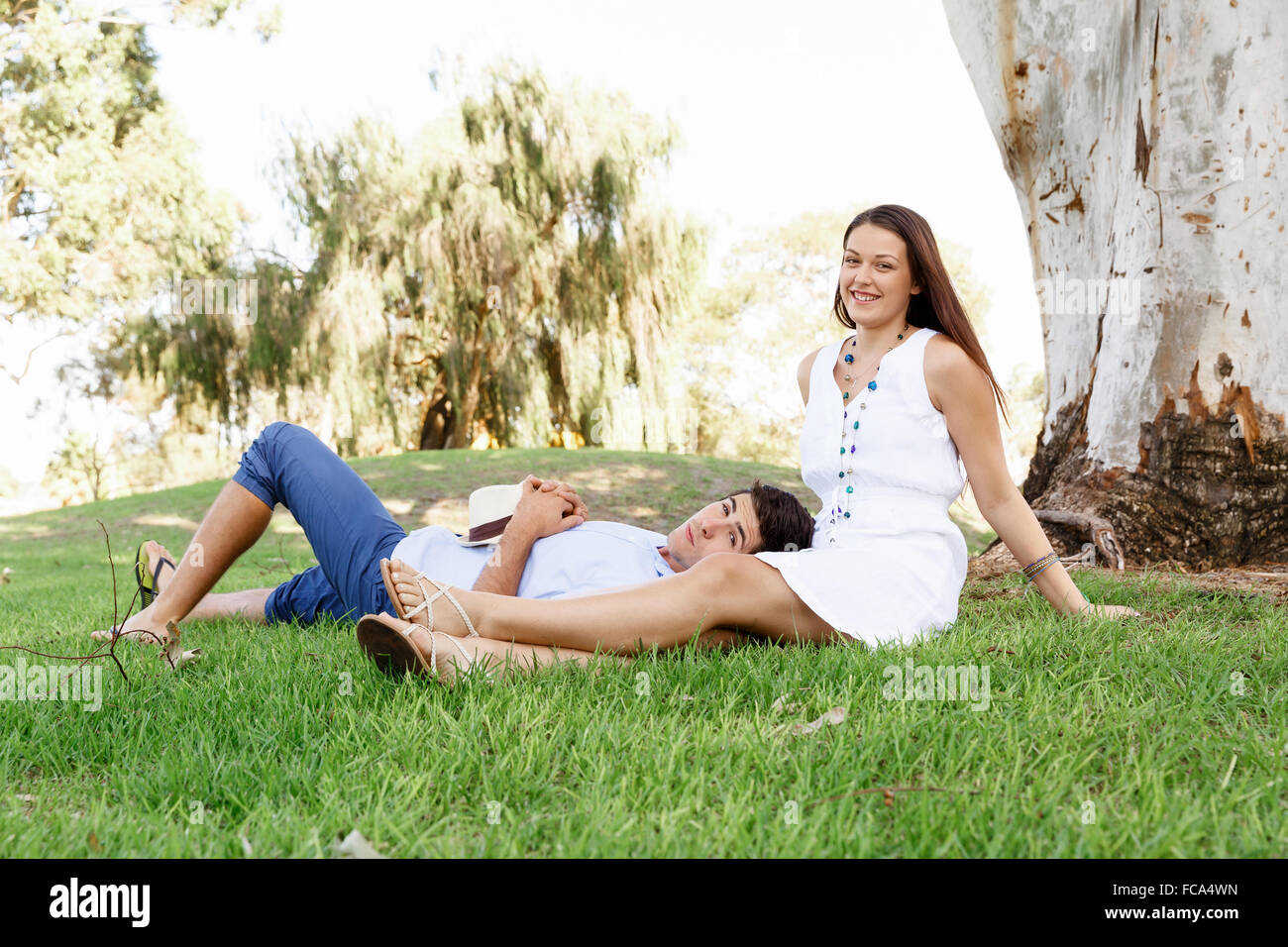 Young happy couple in the park in the summer Stock Photo - Alamy