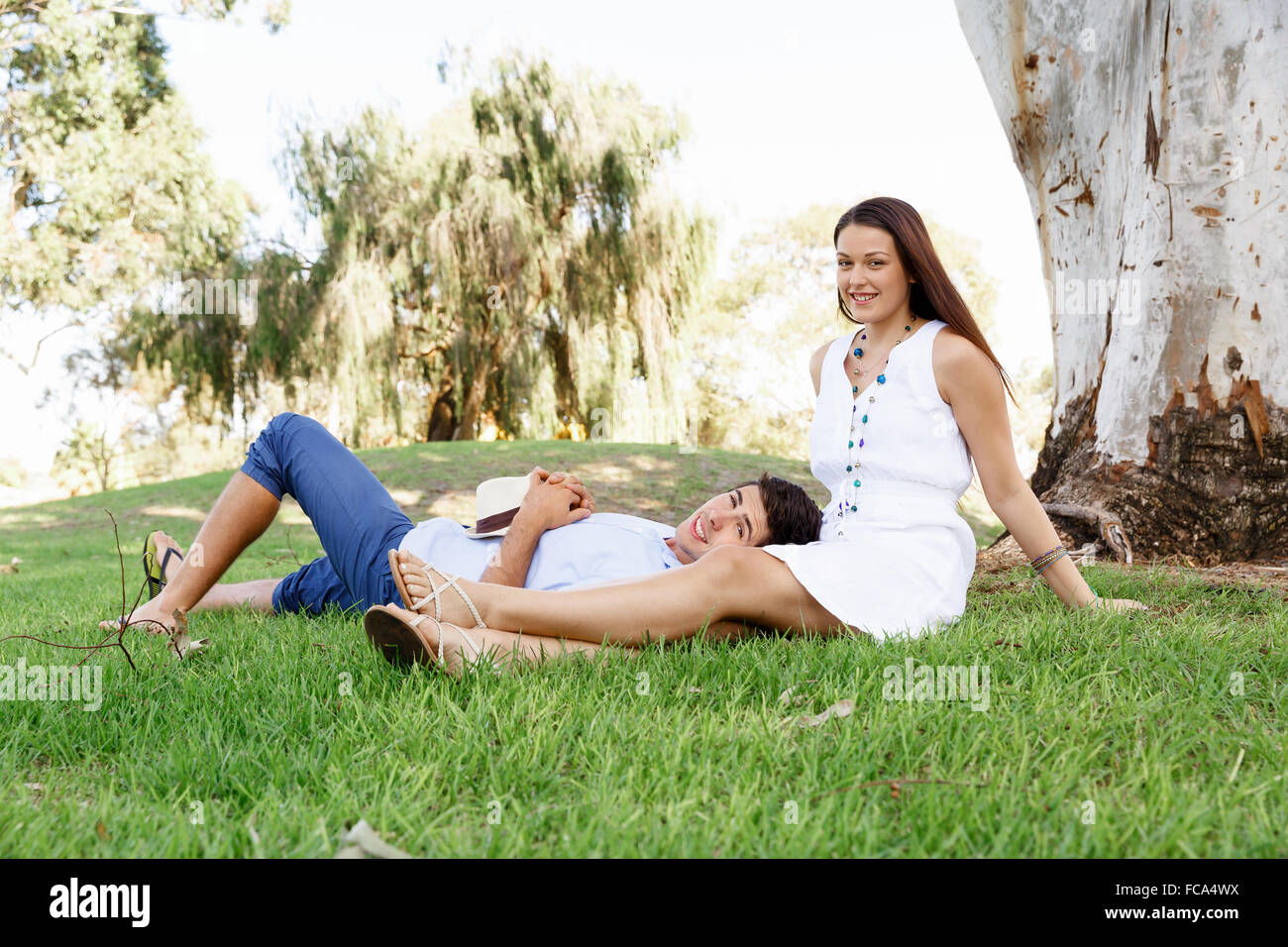 Young happy couple in the park in the summer Stock Photo - Alamy