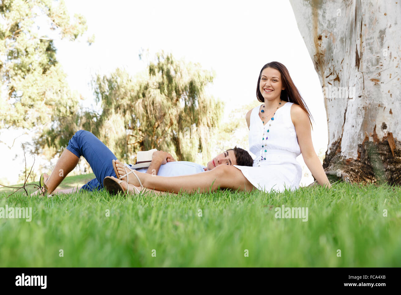 Young happy couple in the park in the summer Stock Photo - Alamy