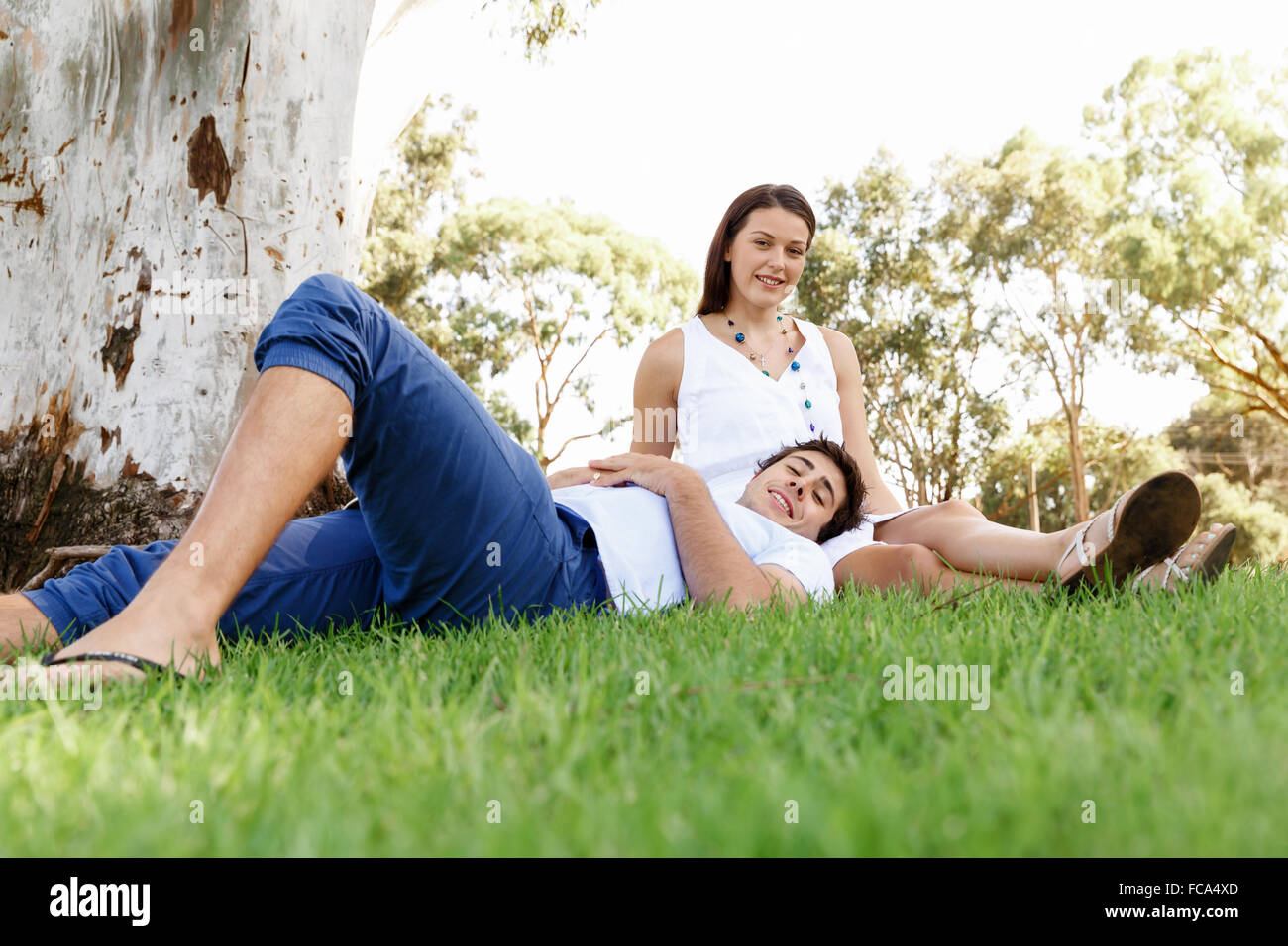 Young happy couple in the park in the summer Stock Photo - Alamy