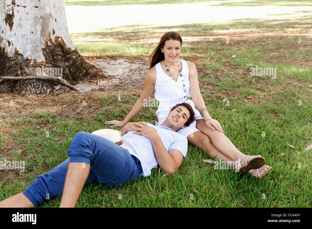 Young happy couple in the park in the summer Stock Photo - Alamy