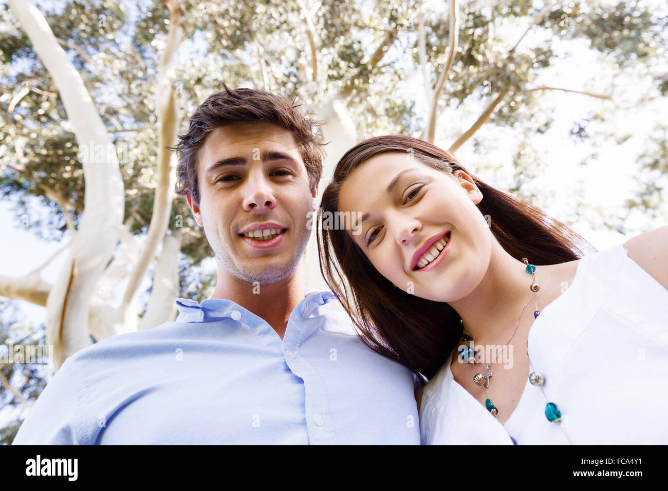Young happy couple in the park in the summer Stock Photo - Alamy