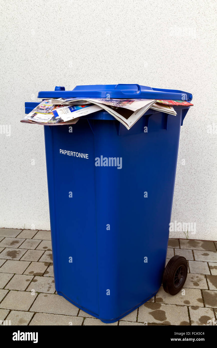 Blue waste paper recycling bin Stock Photo