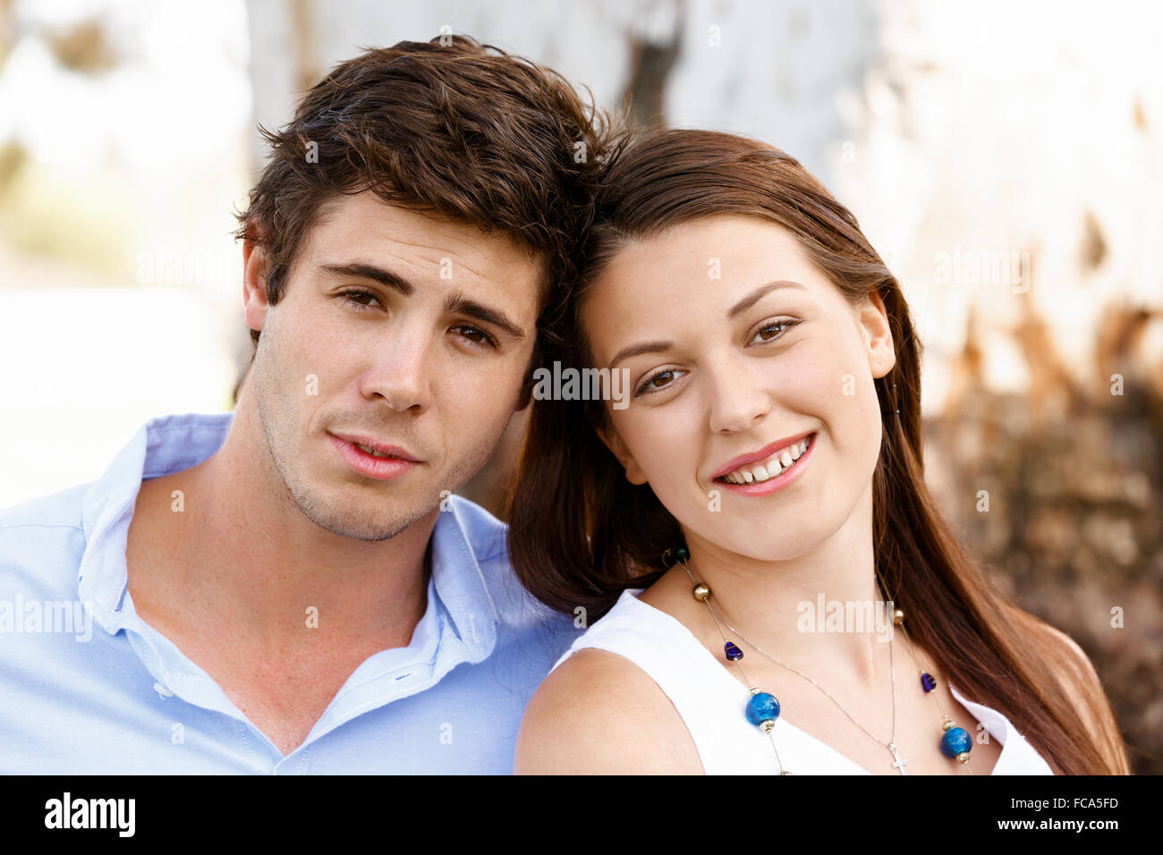 Young happy couple in the park in the summer Stock Photo - Alamy