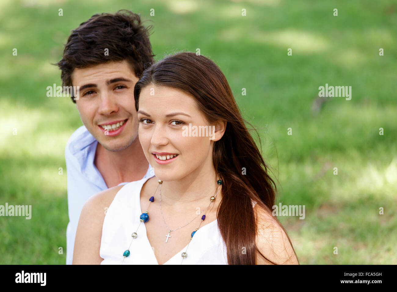Young happy couple in the park in the summer Stock Photo - Alamy