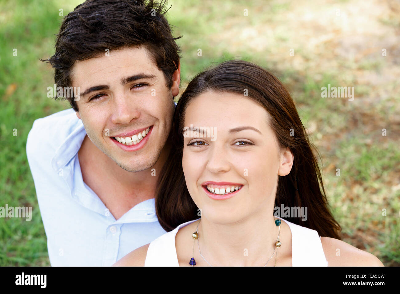 Young happy couple in the park in the summer Stock Photo - Alamy
