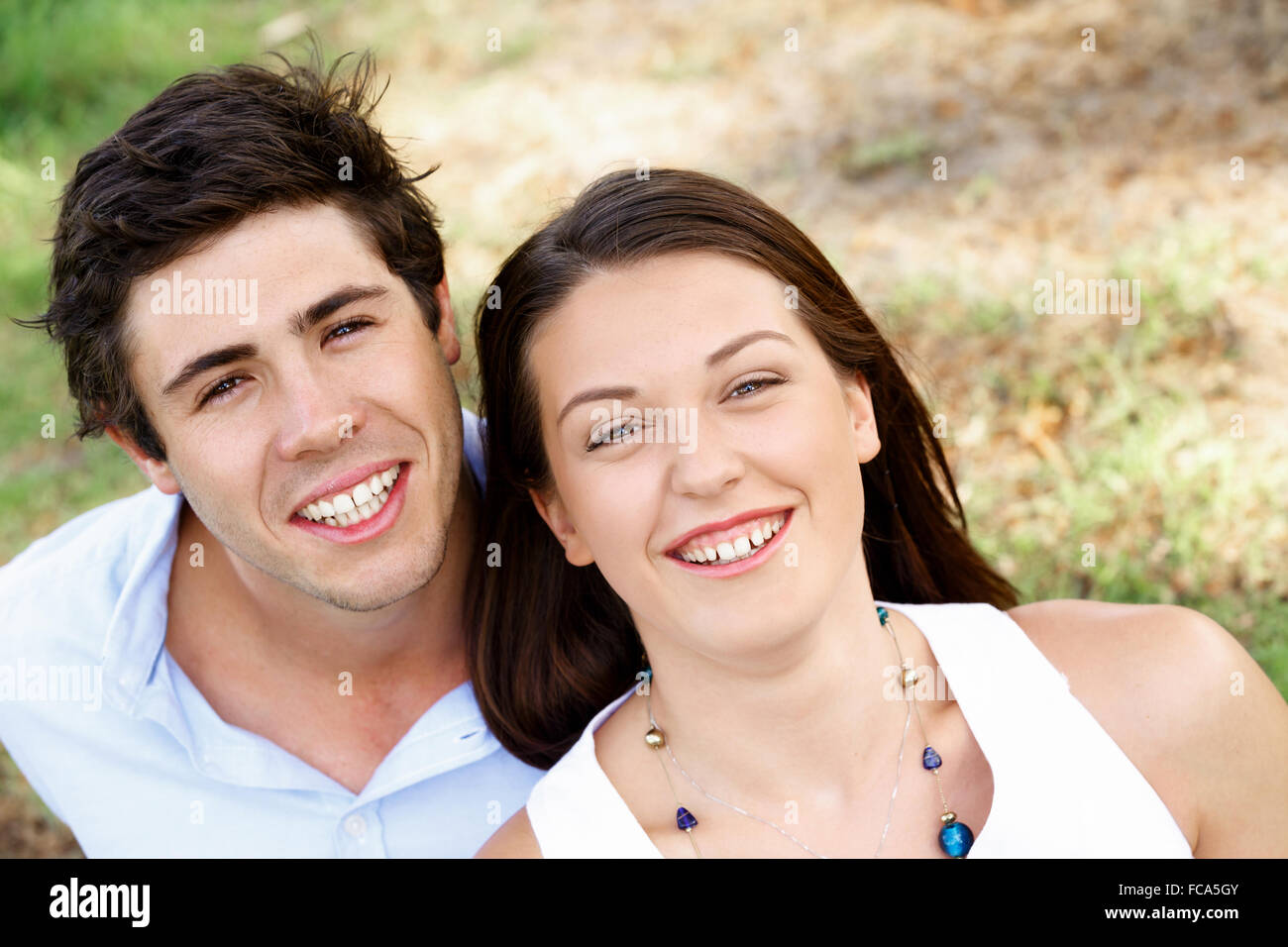 Young happy couple in the park in the summer Stock Photo - Alamy