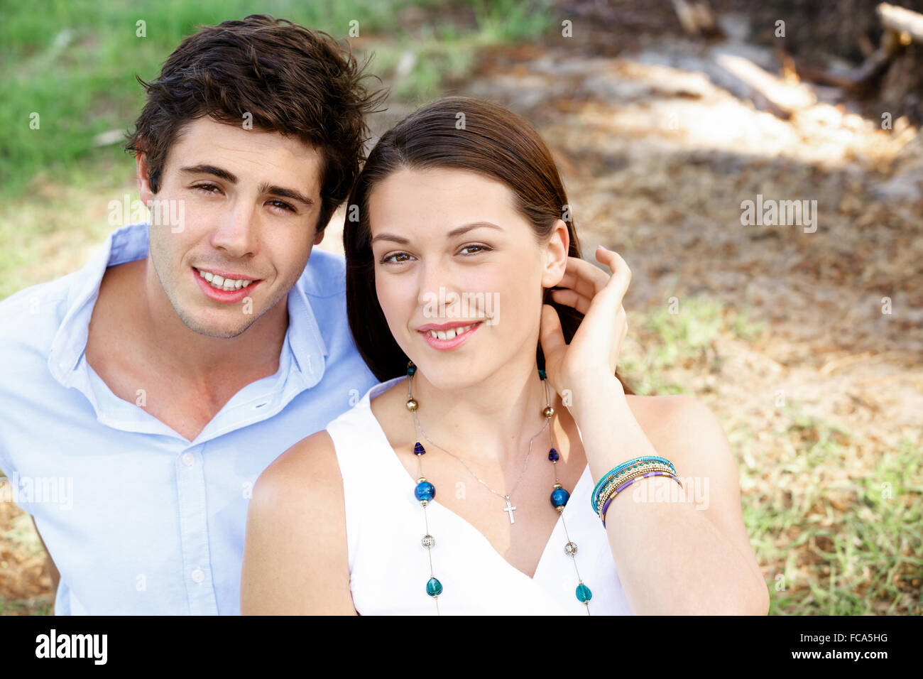 Young happy couple in the park in the summer Stock Photo - Alamy