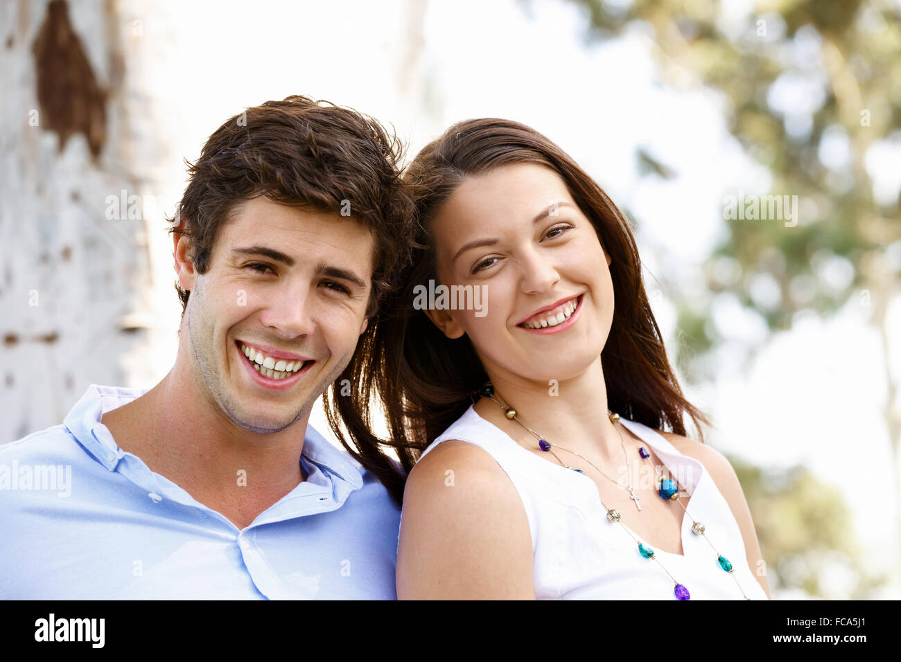 Young happy couple in the park in the summer Stock Photo - Alamy