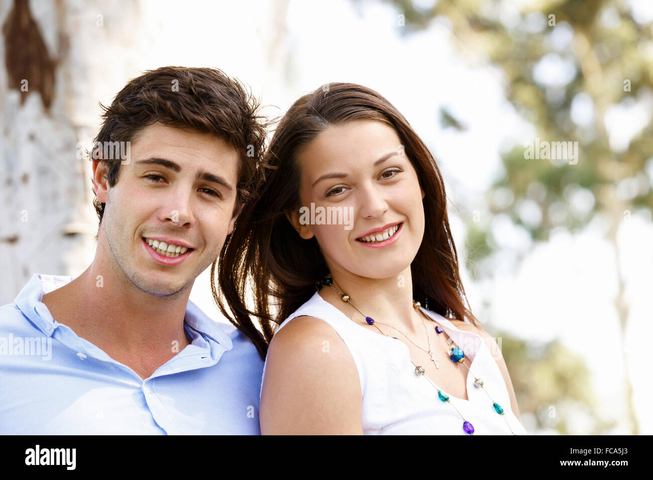 Young happy couple in the park in the summer Stock Photo - Alamy
