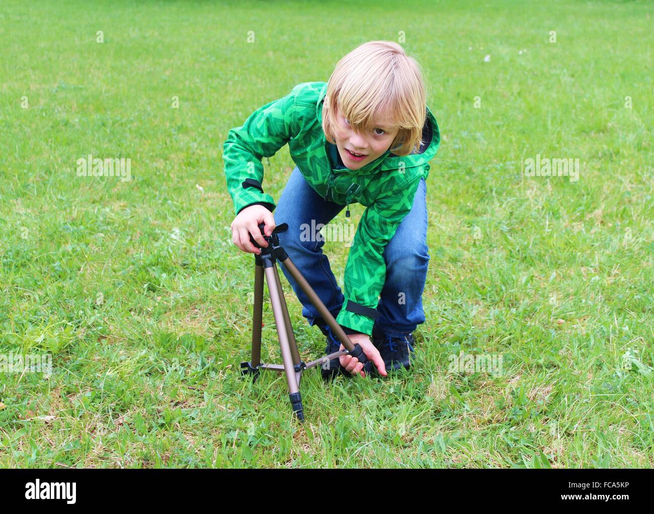 Child holding photograph tripod Stock Photo Alamy