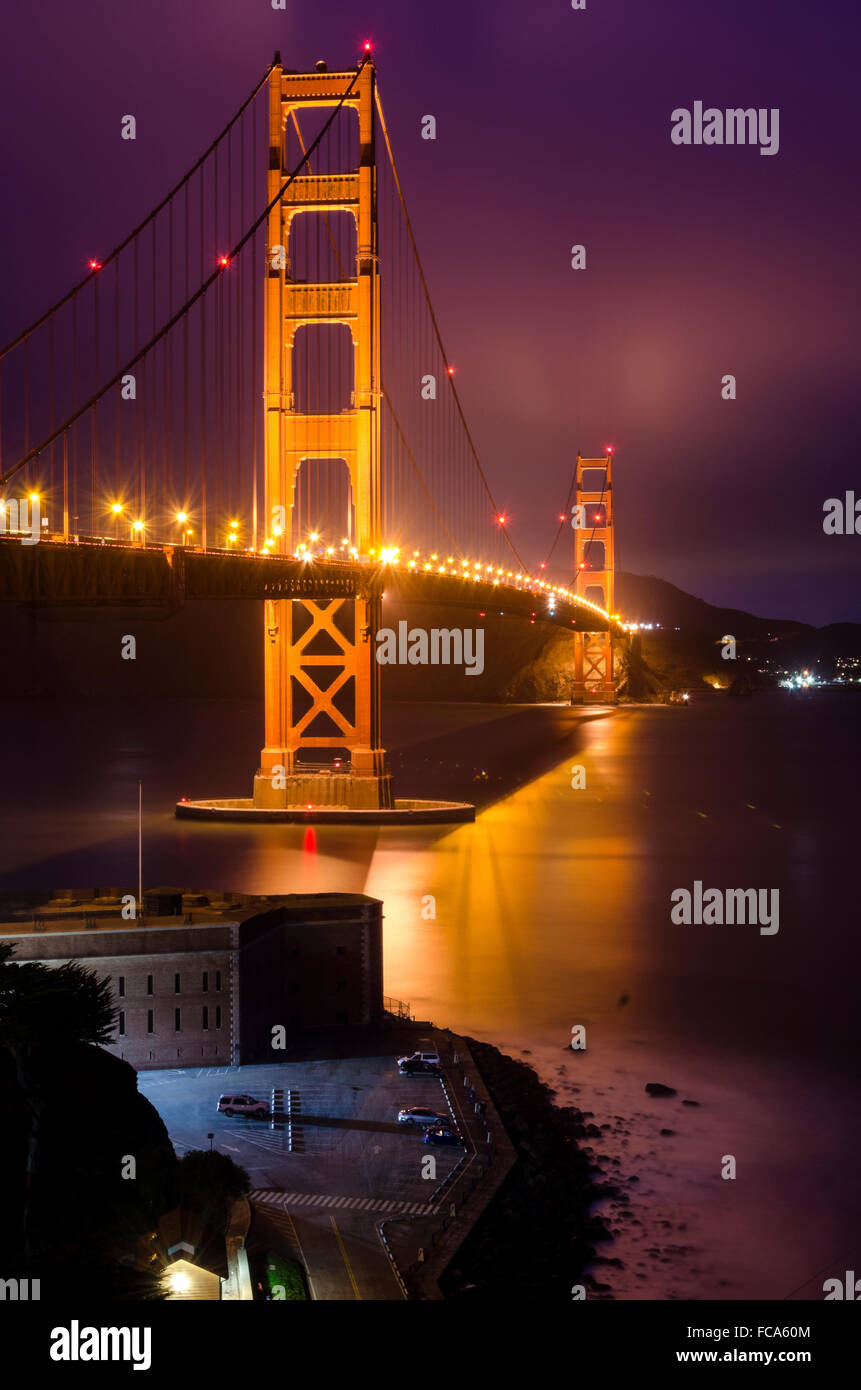 The famous San Francisco Golden Gate Bridge in California, United States of America. A long exposure of Fort Point, the bay and  Stock Photo