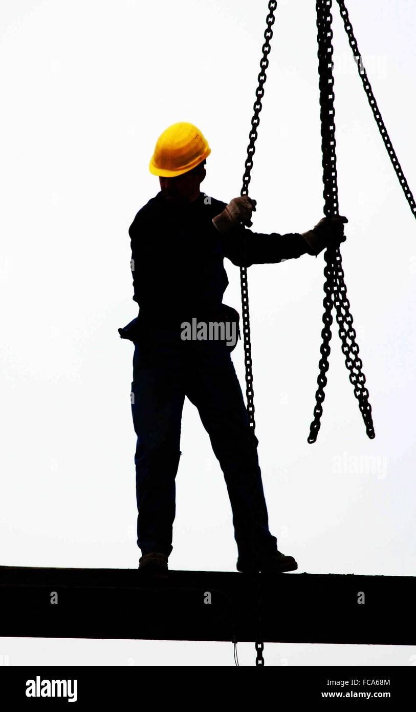 Sillhouette of a construction worker Stock Photo