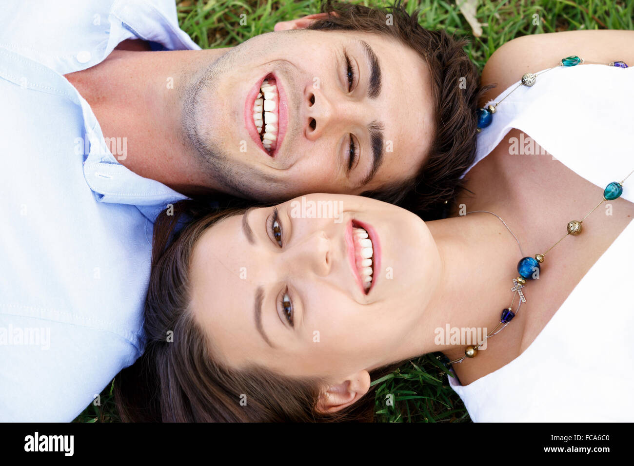 Young happy couple in the park in the summer Stock Photo - Alamy