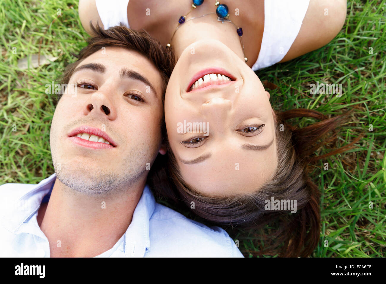 Young happy couple in the park in the summer Stock Photo - Alamy