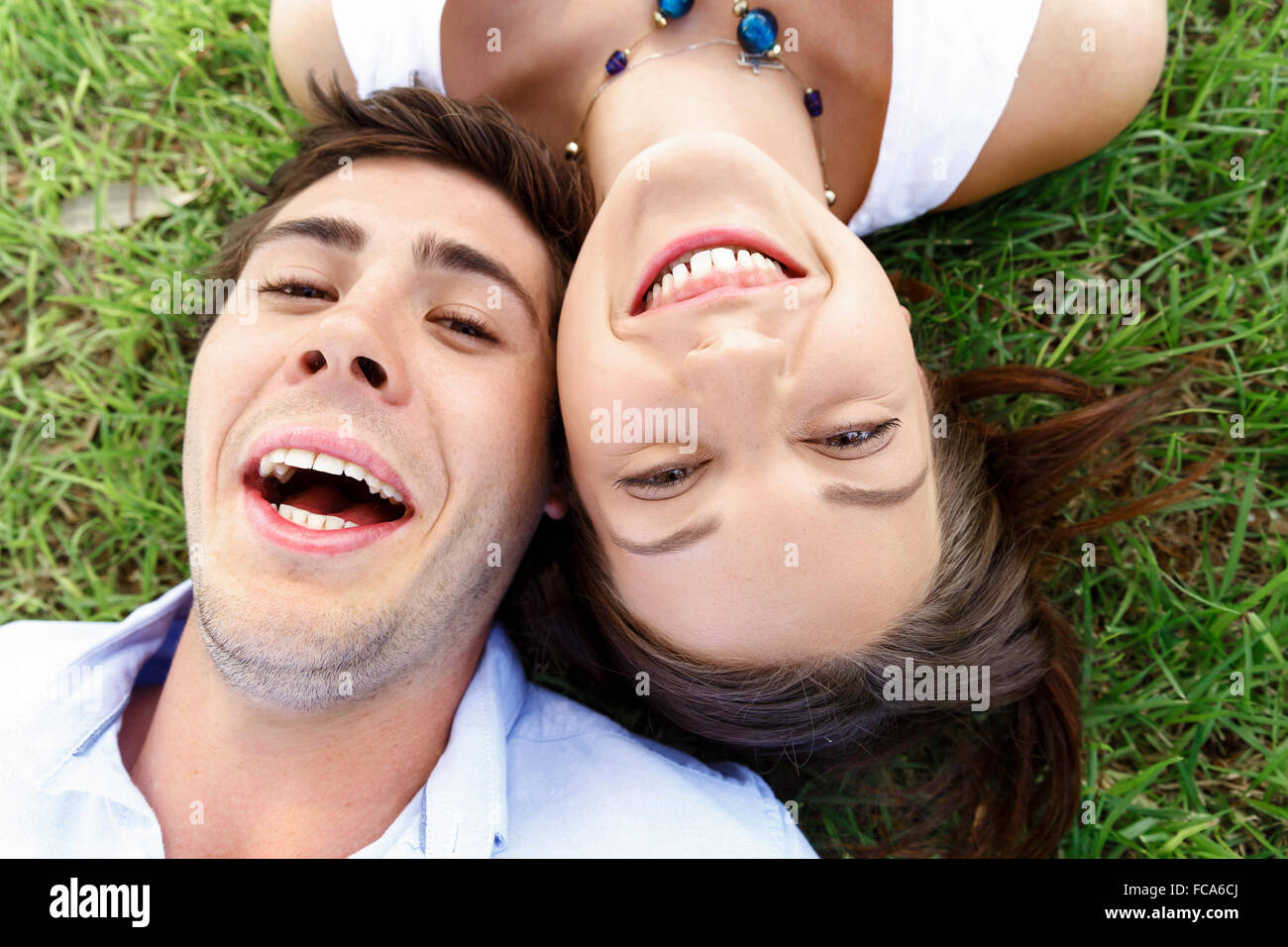Young happy couple in the park in the summer Stock Photo - Alamy