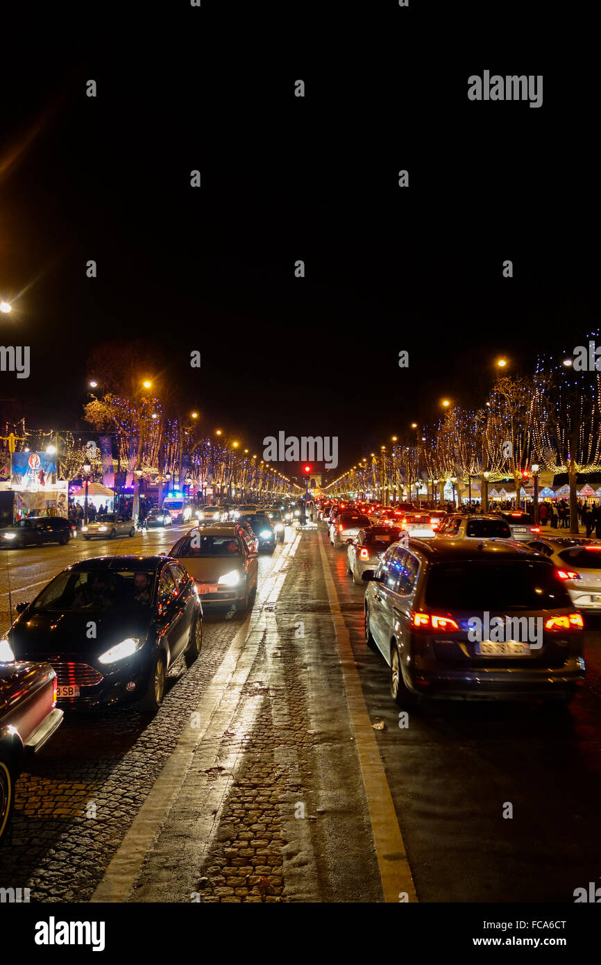 Champs Elysee at night, with Arc de Triomphe and traffic, Paris, France. Stock Photo