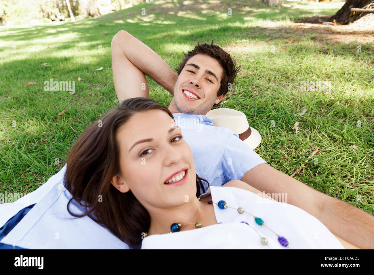 Young happy couple in the park in the summer Stock Photo - Alamy
