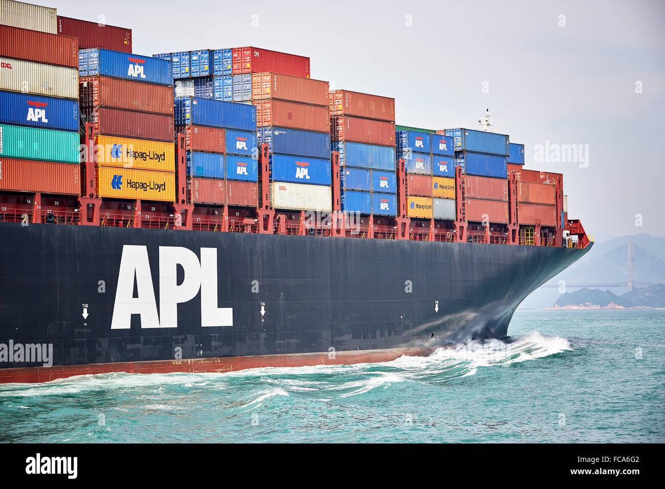 Detail of a A fully laden container ship making its way to the Tsing Yi container terminal in Hong Kong. Stock Photo